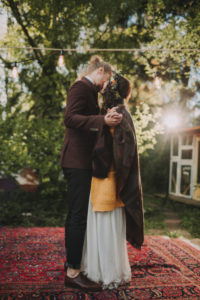Bride and groom at alternative wedding celebration outside Bride and groom at alternative wedding celebration outside